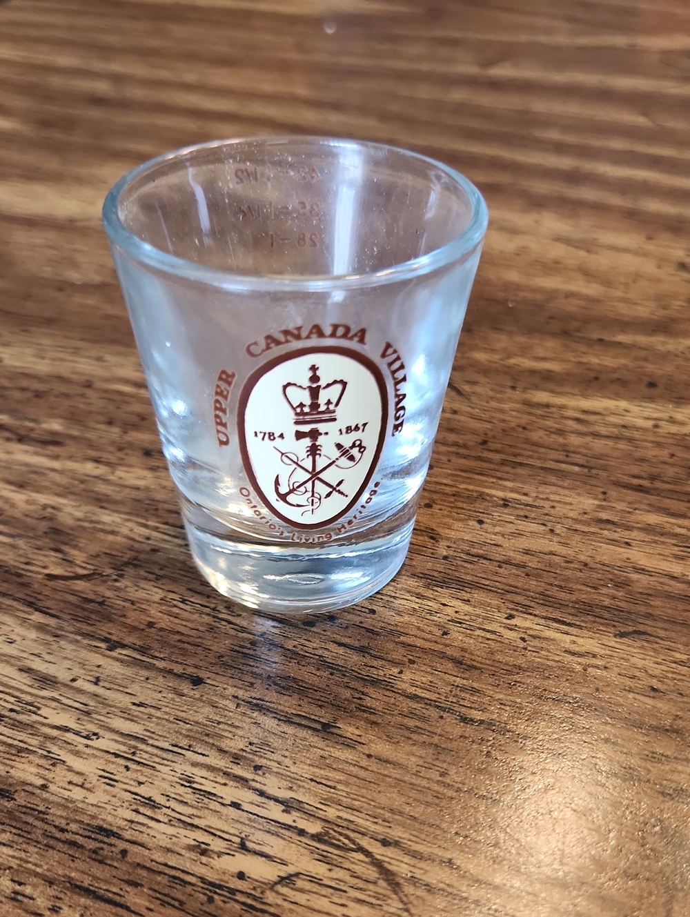 Upper Canada Village Crest Shot Glass - Clear with Maroon Logo
